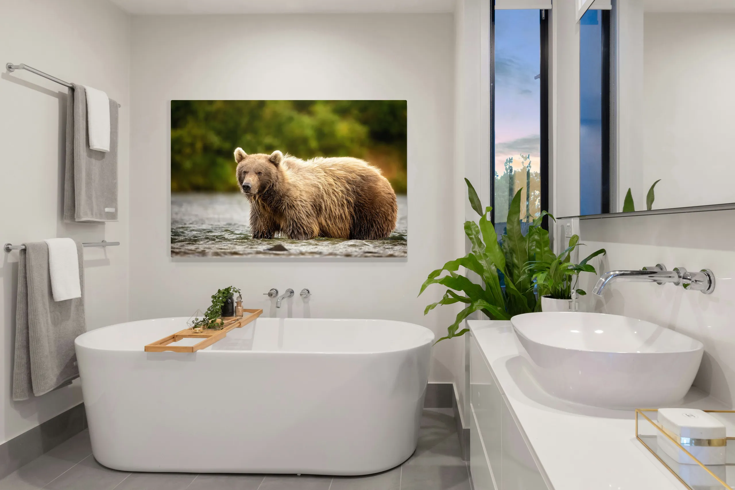 Beauty Queen, a print of a brown bear, hung above a bathtub