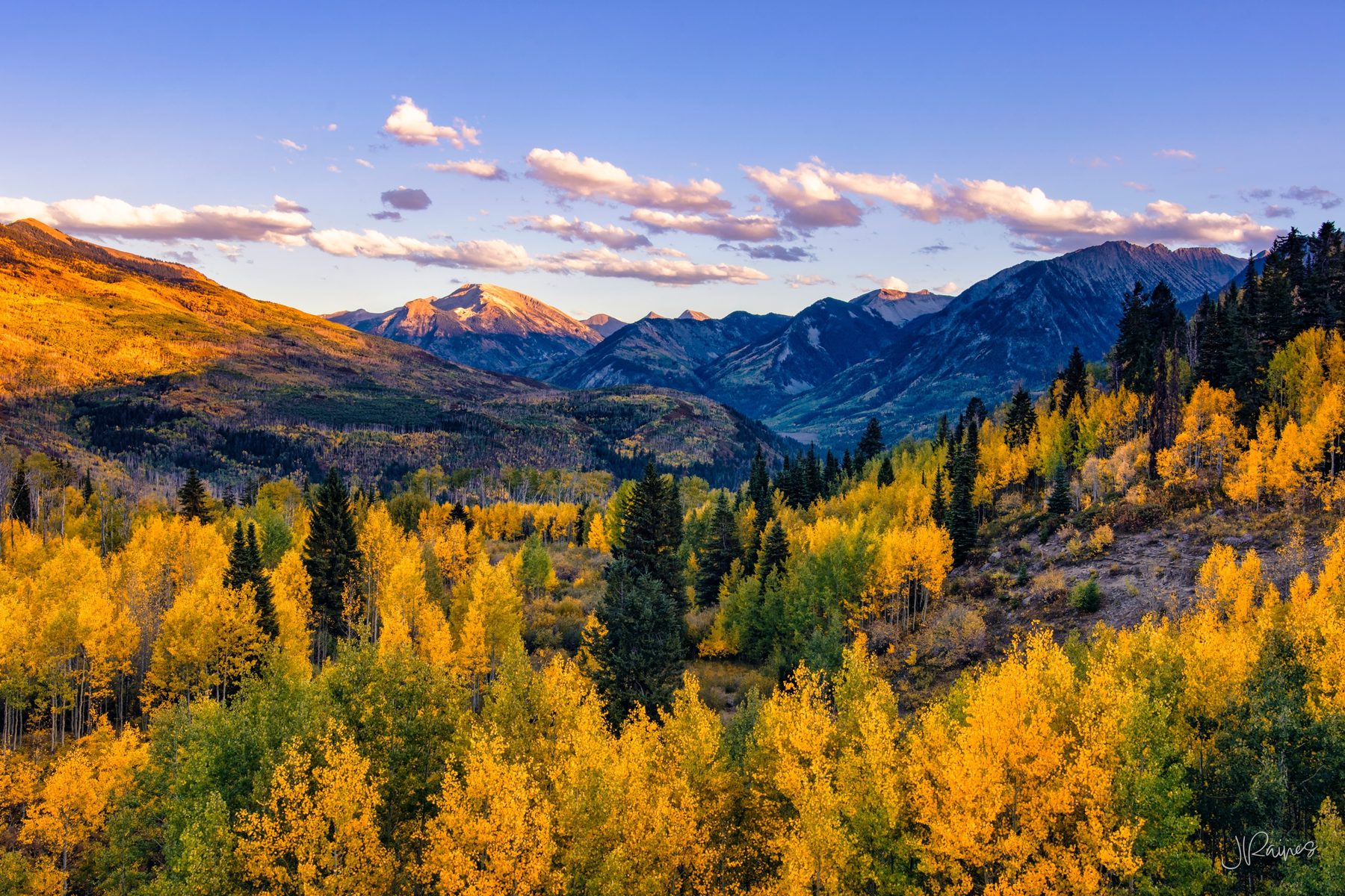 McClure Pass in Colorado with autumn aspens and evening sun