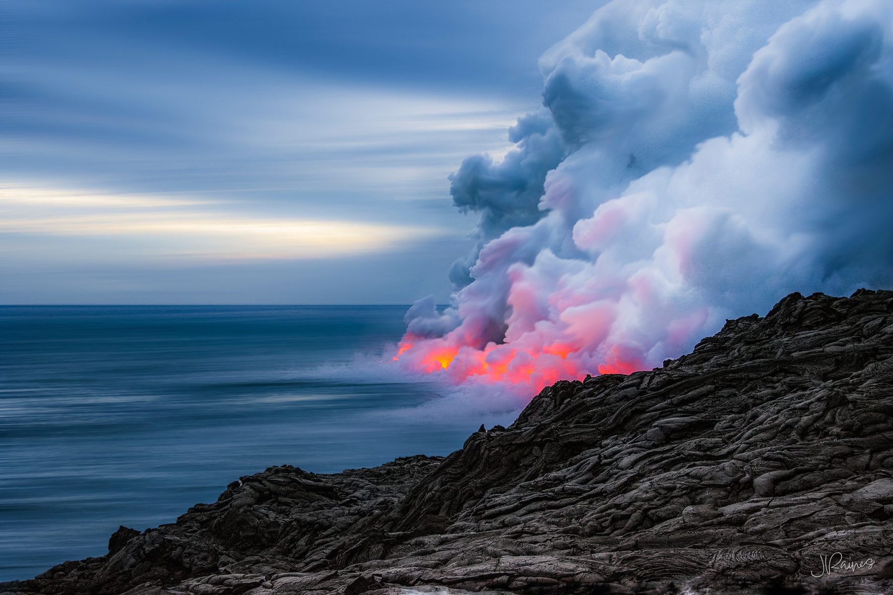 Lava flowing into the ocean at Volcano National Park in Hawaii