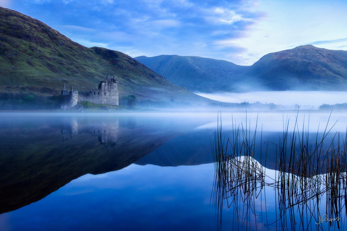 Kilchurn Castle with fog and pre-dawn lake reflections, Argyll and Bute, Scotland