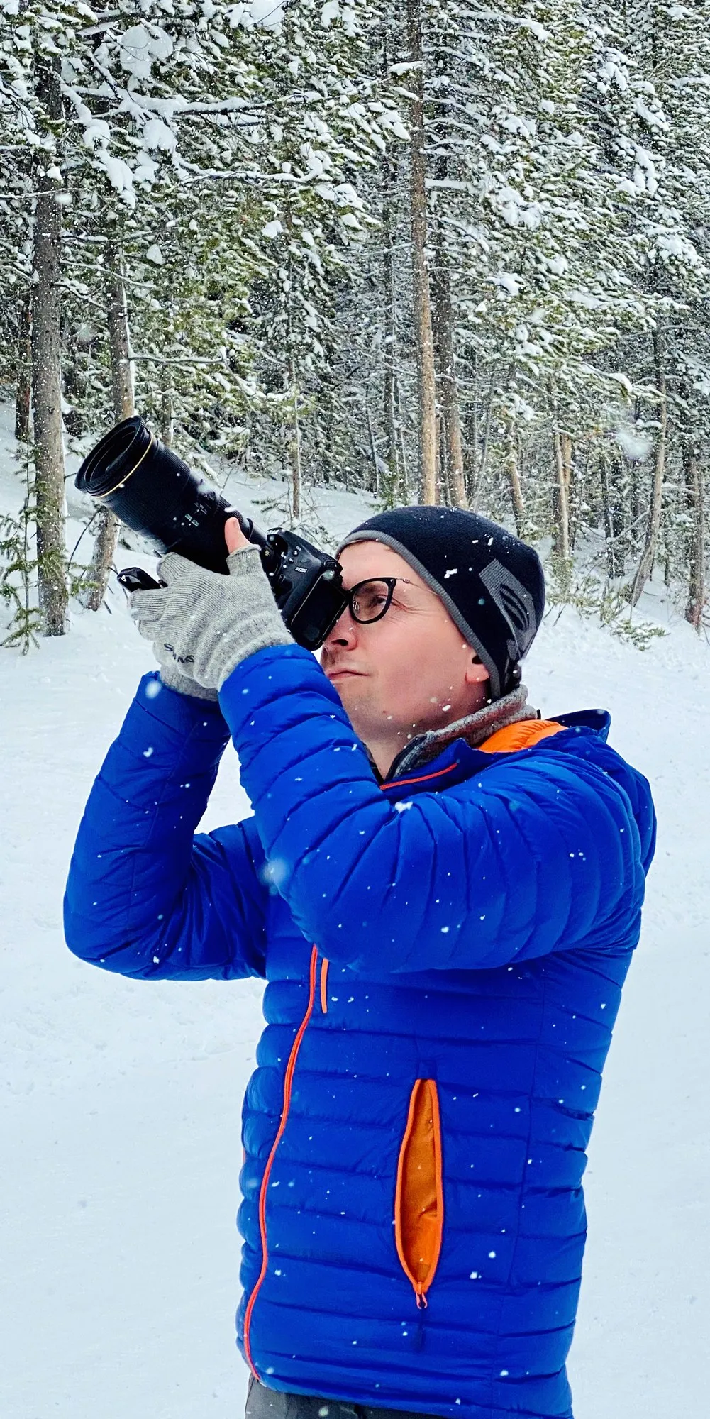 Jerad Raines photographing during snowfall in Grand Teton National Park, Wyoming