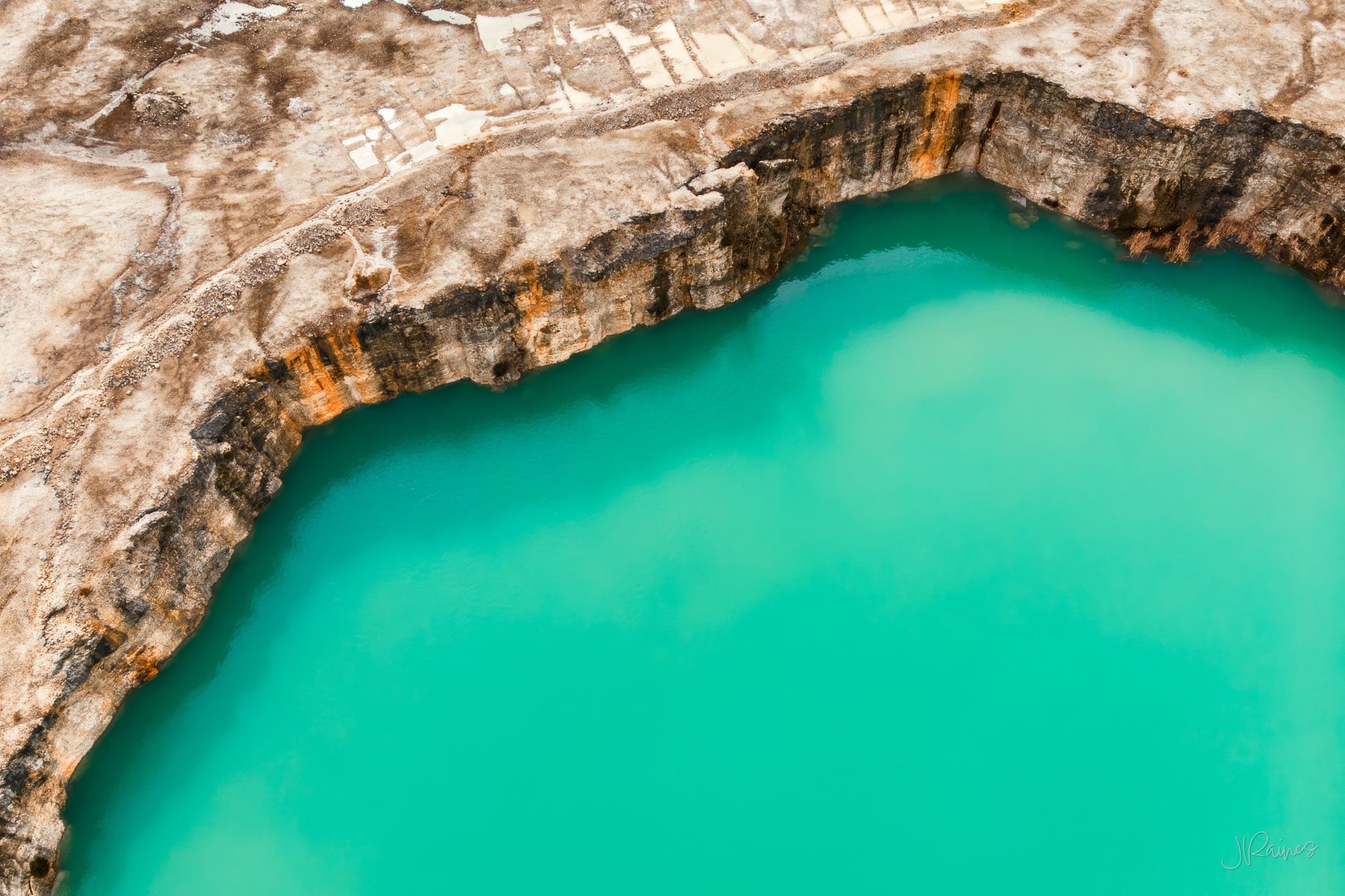 Overhead shot of limestone quarry with green water, Southern Ohio