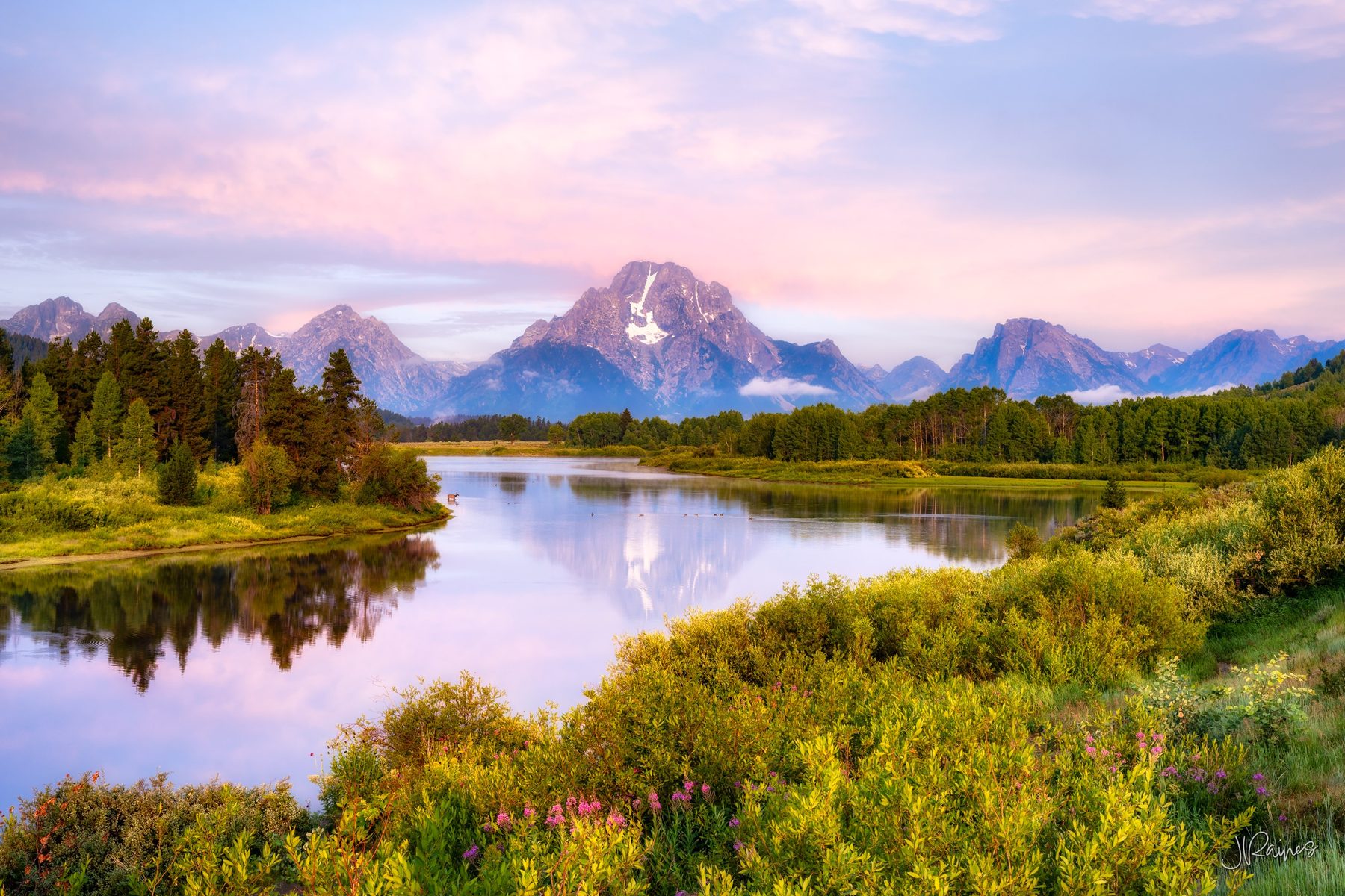 Teton Mountain range reflecting in the Snake River