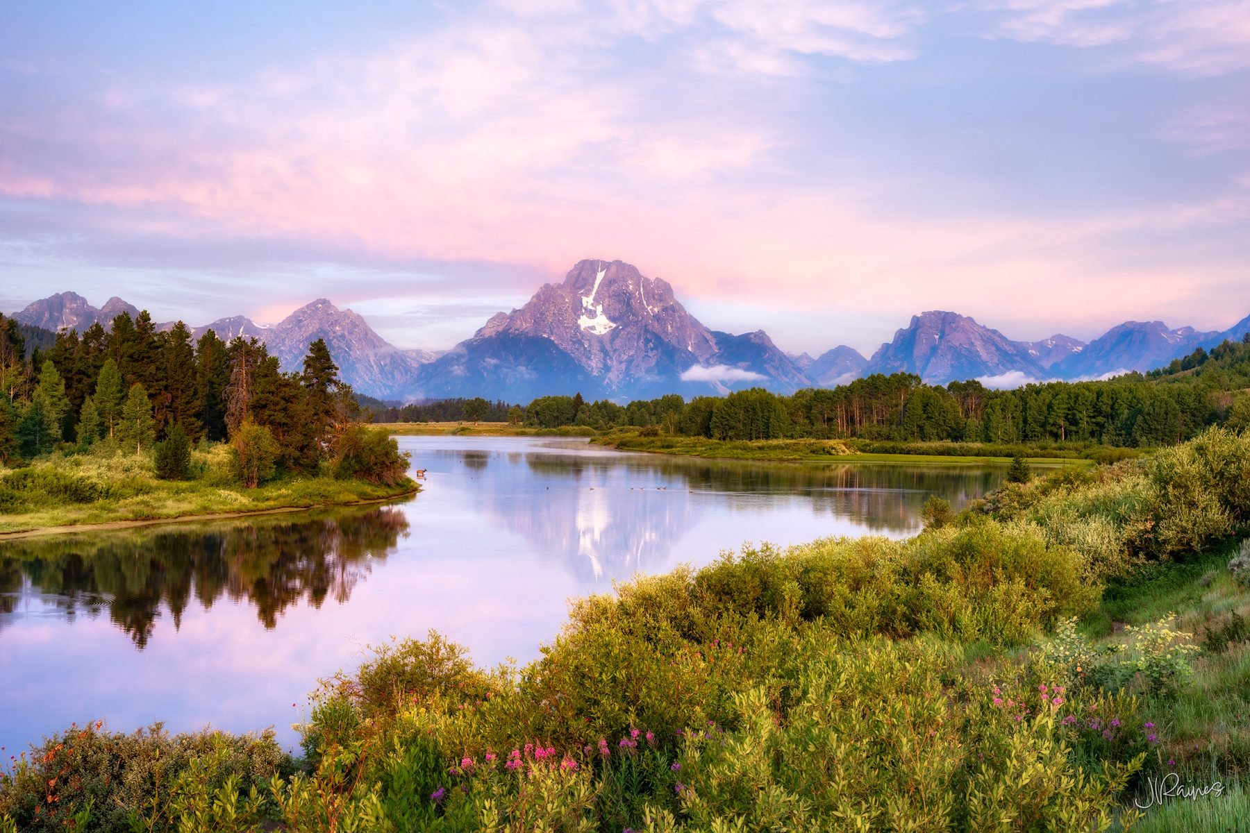 Teton Mountain range reflecting in the Snake River