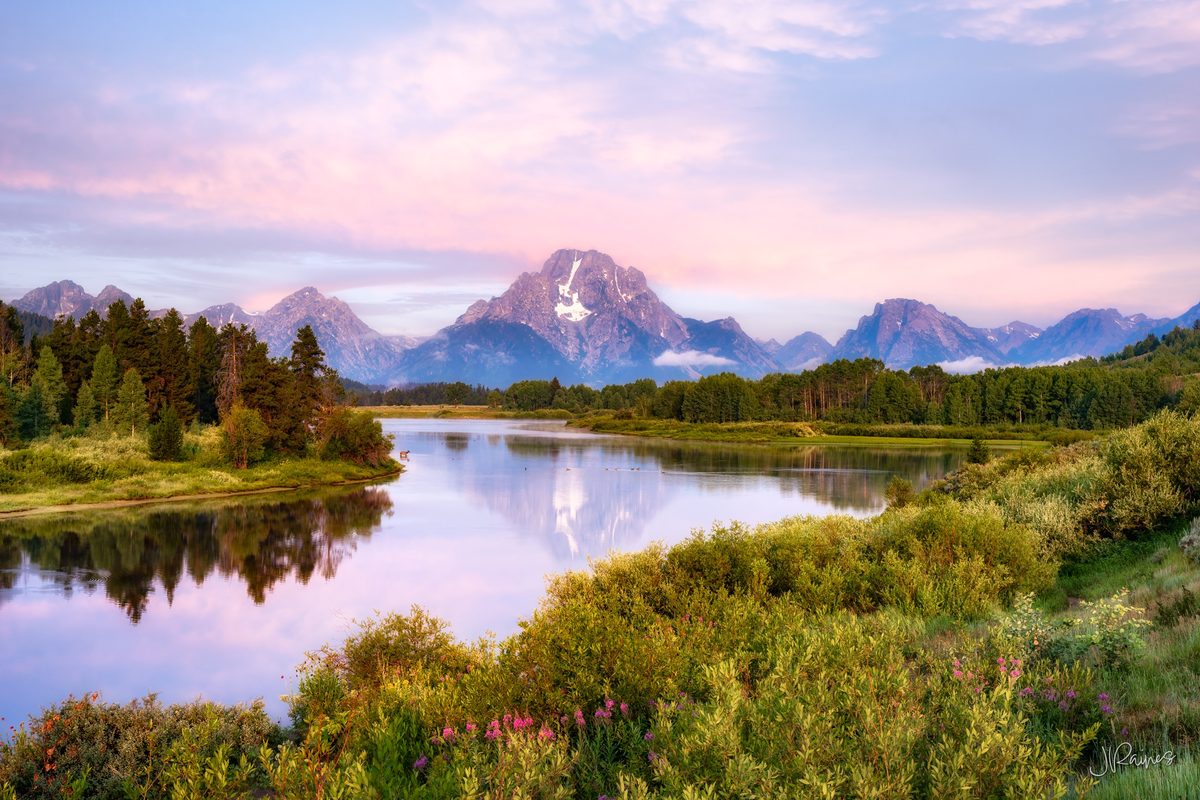 Teton Mountain range reflecting in the Snake River