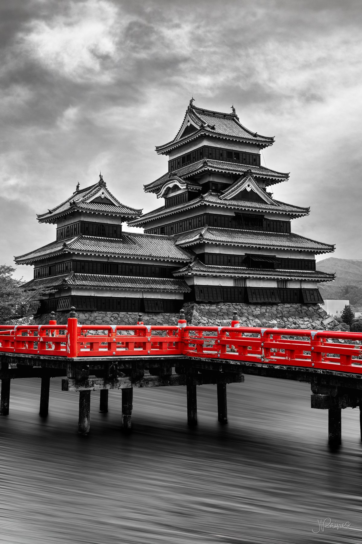 Matsumoto Castle and moat with red bridge in Japan
