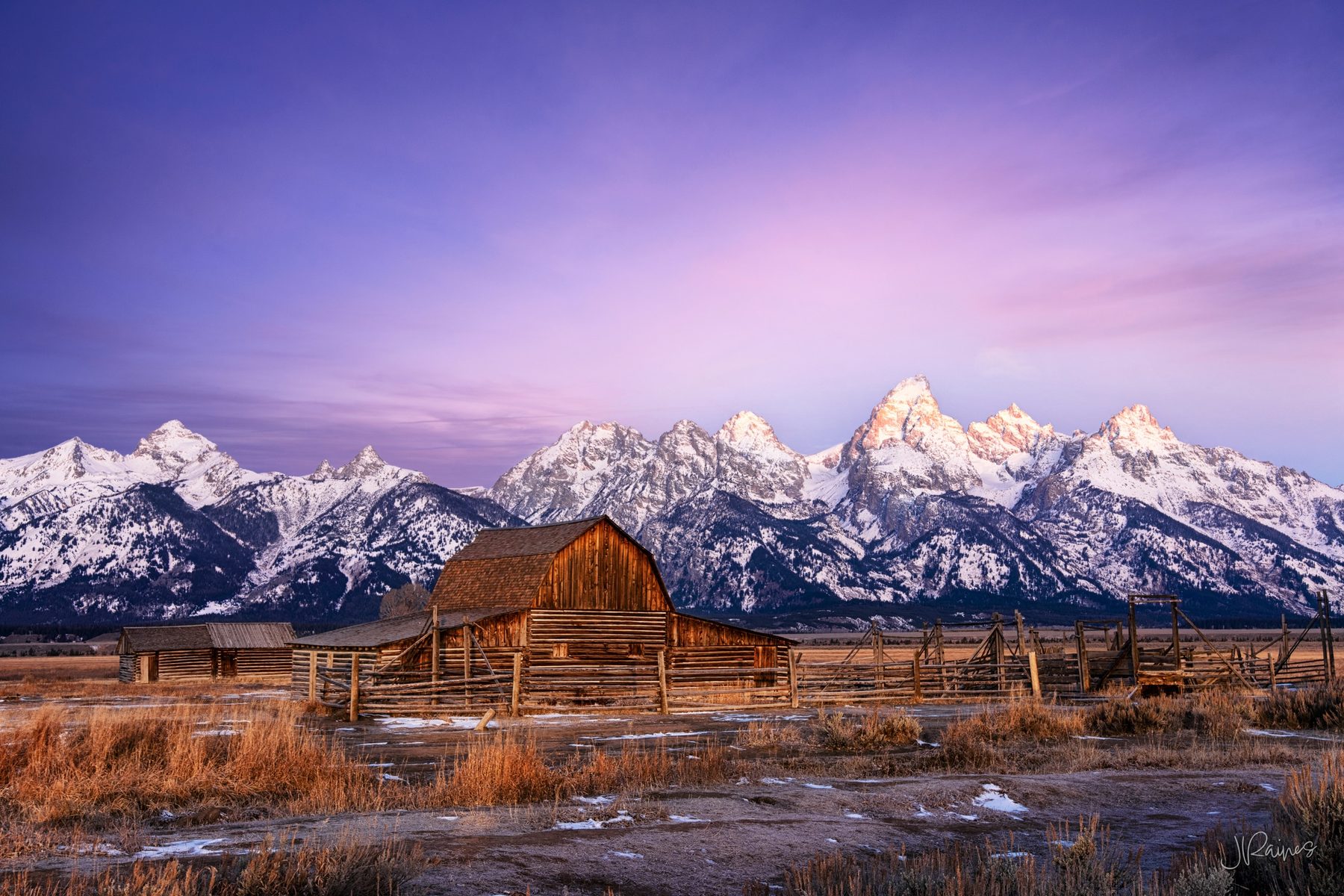 Mormon barn and Teton Mountain range at sunrise