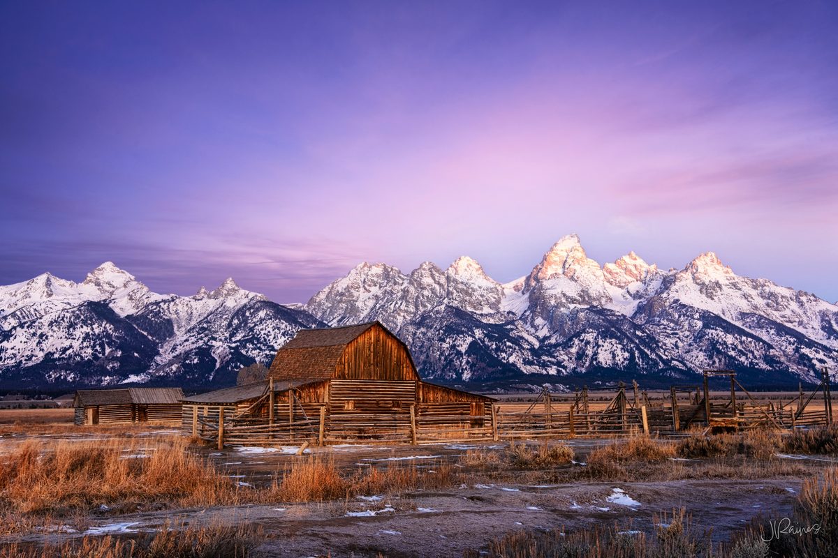 Mormon barn and Teton Mountain range at sunrise