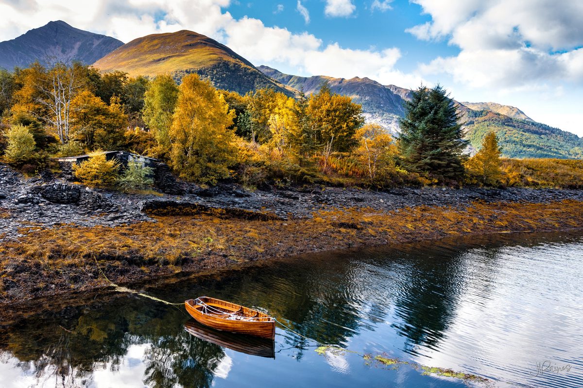 A trout boat moored on a slate beach near Ballachulish