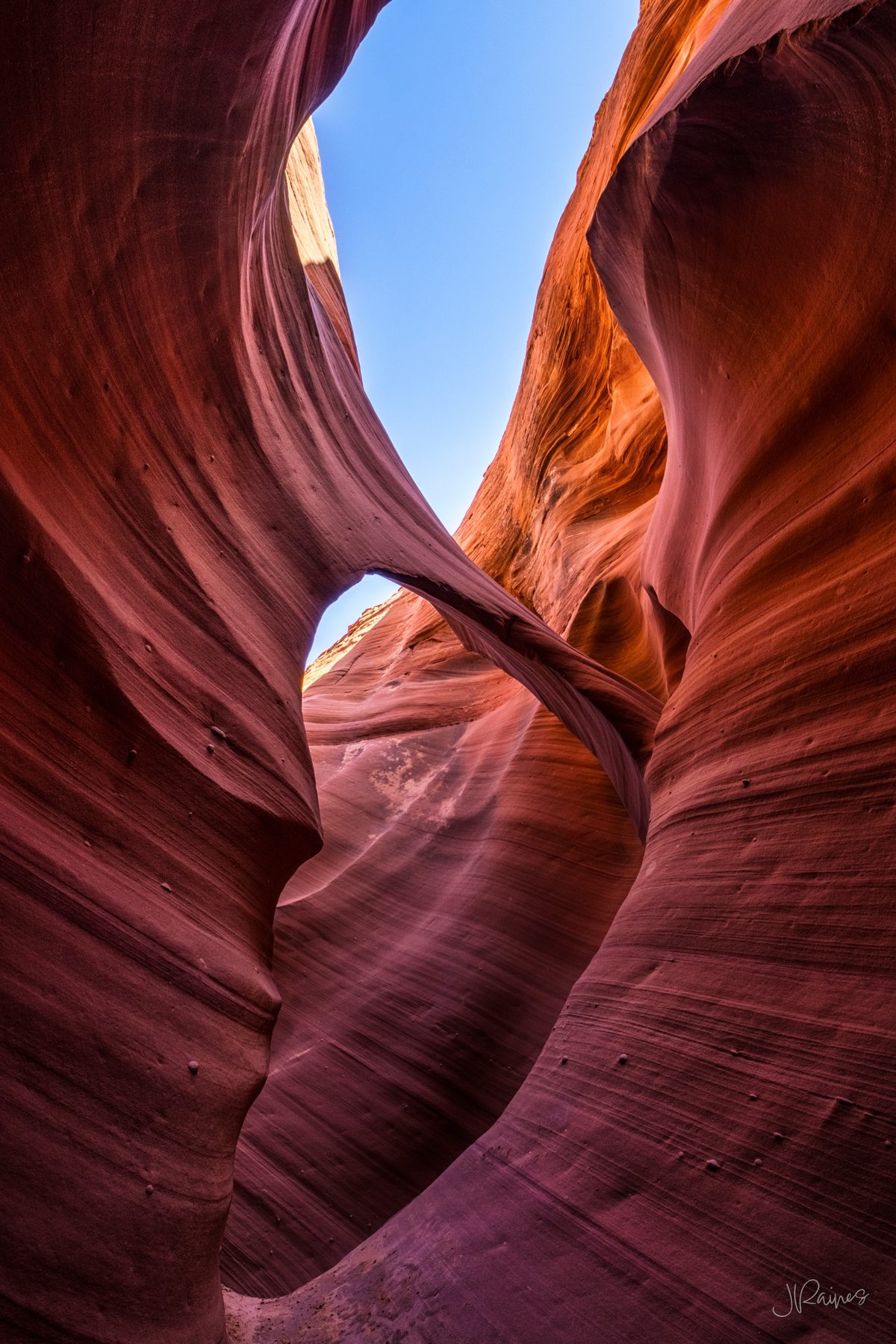 Delicate sandstone arch in a slot canyon of northern Arizona