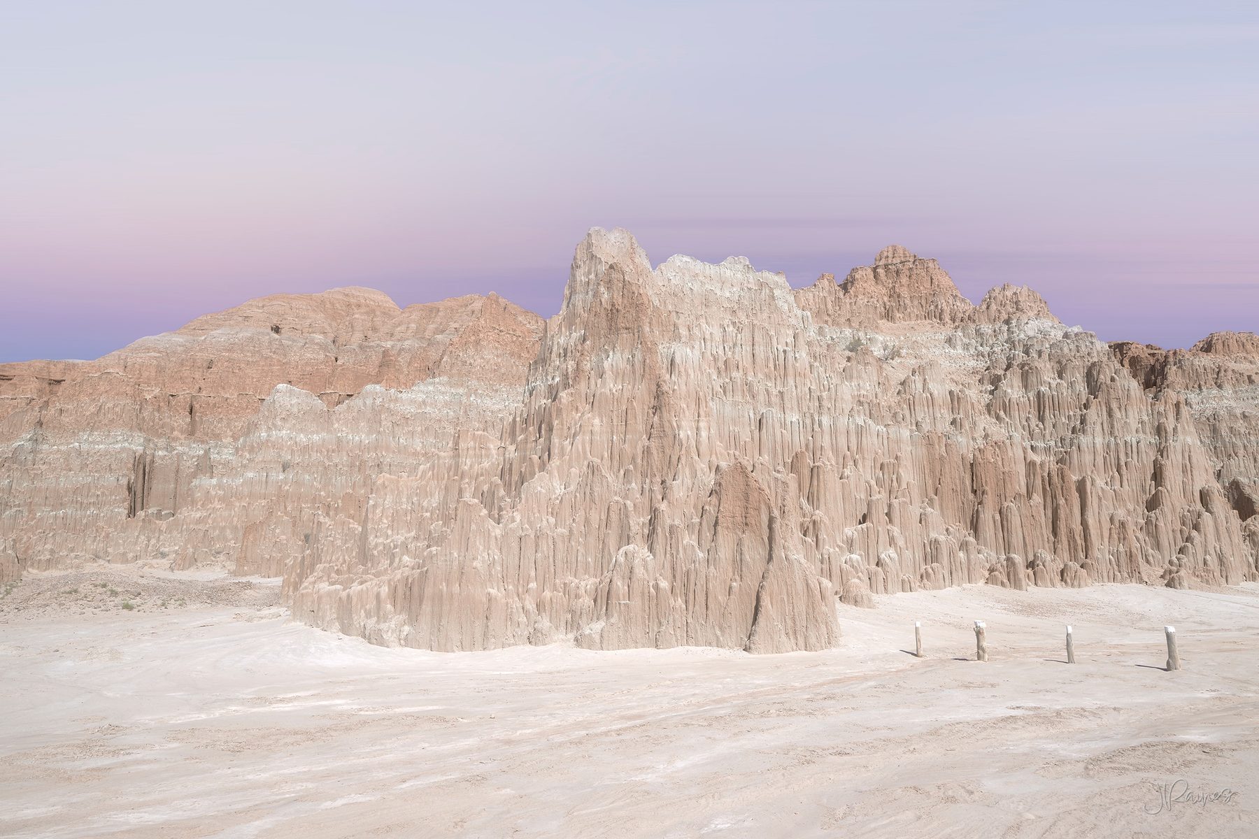Clay spires at Cathedral Gorge State Park, Nevada, standing pale against a deep desert sky
