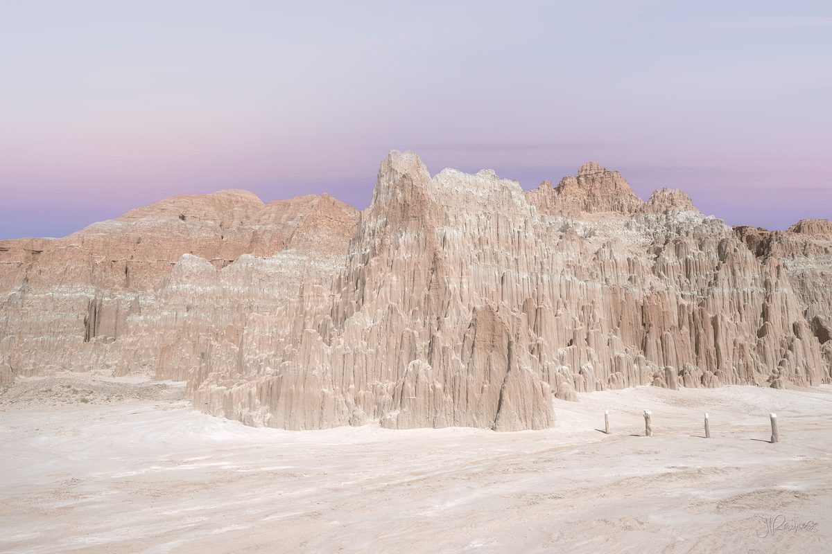 Clay spires at Cathedral Gorge State Park, Nevada, standing pale against a deep desert sky