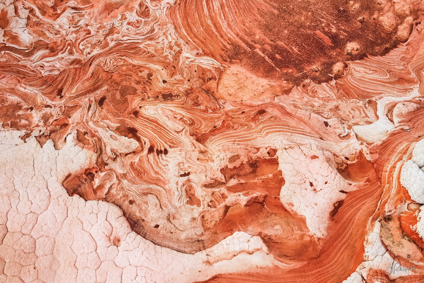 Cross-bedded sandstone at Vermilion Cliffs, Arizona — the frozen record of ancient dunes, turned on edge and eroded back open