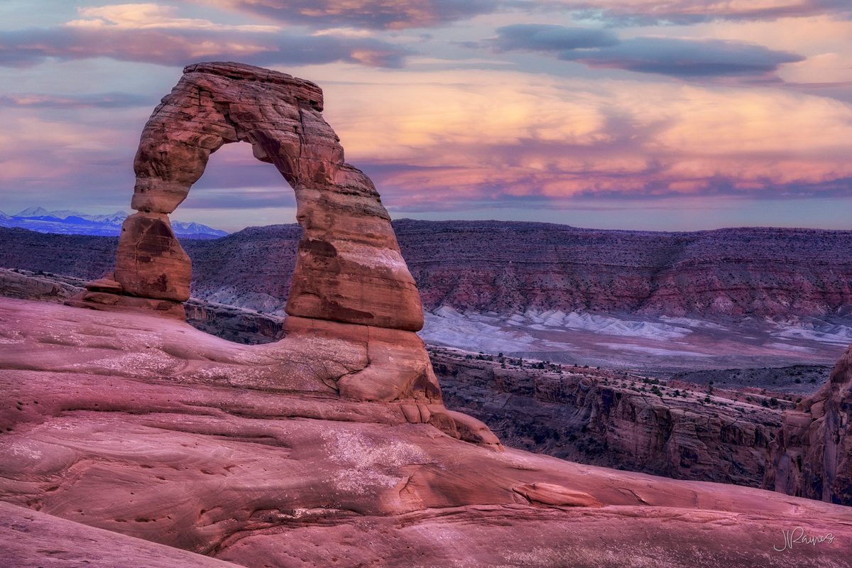Delicate Arch in Arches National Park, Utah — a freestanding span of Entrada sandstone left behind after everything around it eroded away